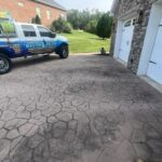 Cleaning and preparing stamped and dyed concrete for application of gloss color enhancing sealer.