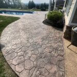Cleaning and preparing stamped and dyed concrete for application of gloss color enhancing sealer.