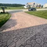 Cleaning and preparing stamped and dyed concrete for application of gloss color enhancing sealer.